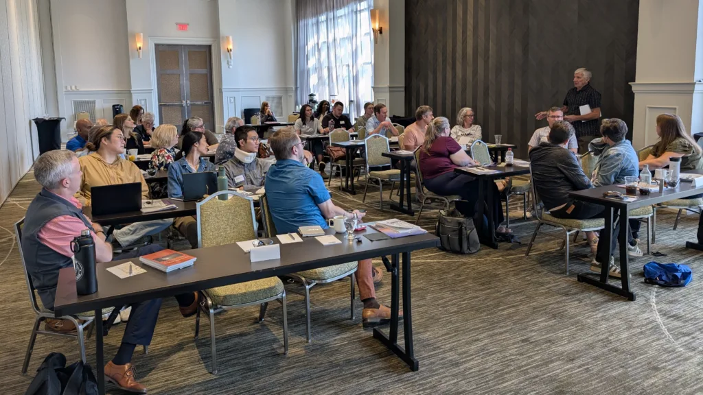 Faculty member engages participants demonstrating the impact of compound interest.